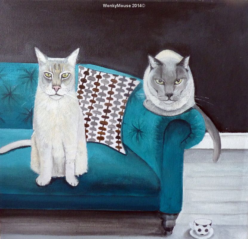 two cats on sofa