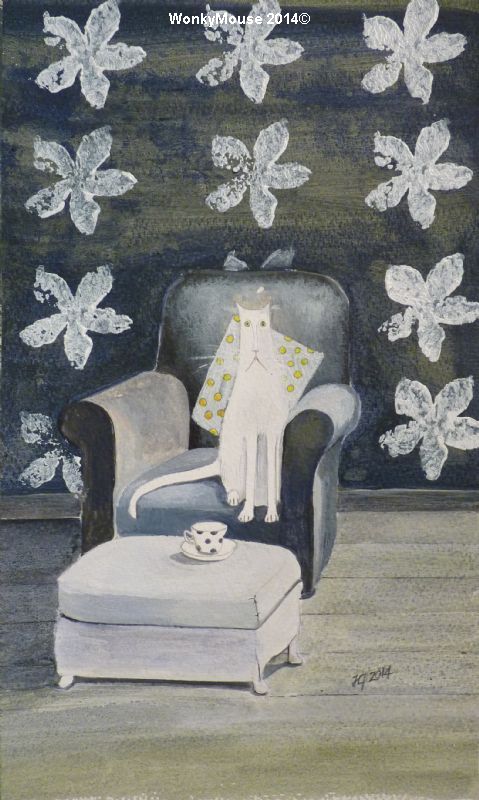 White cat on armchair
